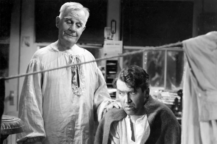 Clarence comforts George Bailey on the bridge. From the movie, It's a Wonderful Life.